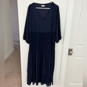 Navy blue, pleated midi dress. V neck, ends mid ankles.